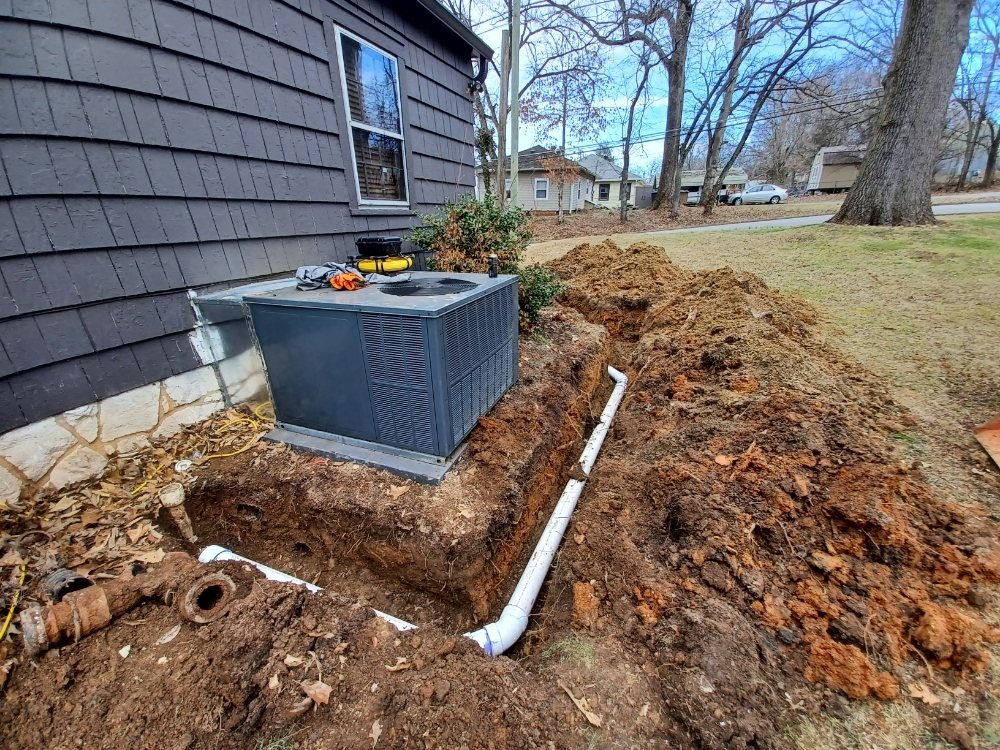 Hicks Services trenching equipment on a residential job